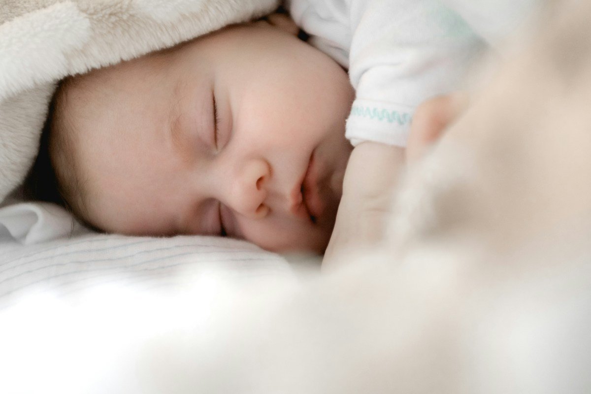 Loving parent holding baby in cozy Chhutkan clothes